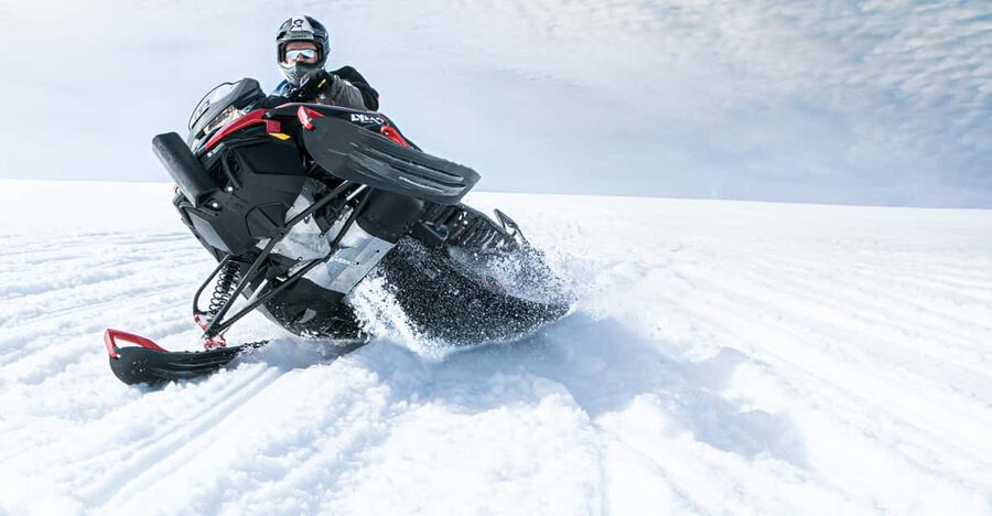 From Geysir: Snowmobiling & Ice Cave on Langjökull Glacier - Getting ready with a helmet, suit, and driving lesson