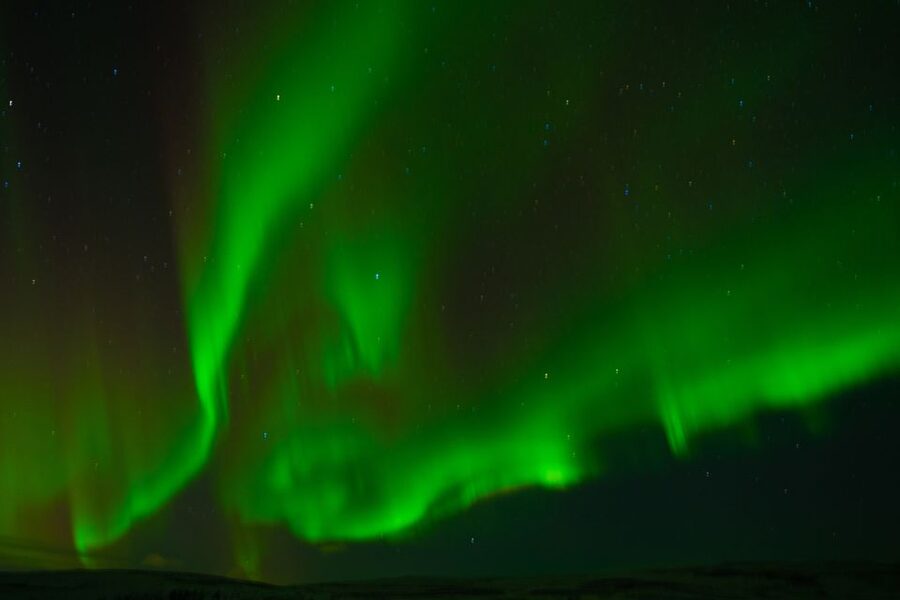 From Reykjavik: Northern Lights Guided Tour with Photos - Hot chocolate, blankets, and the cold factor