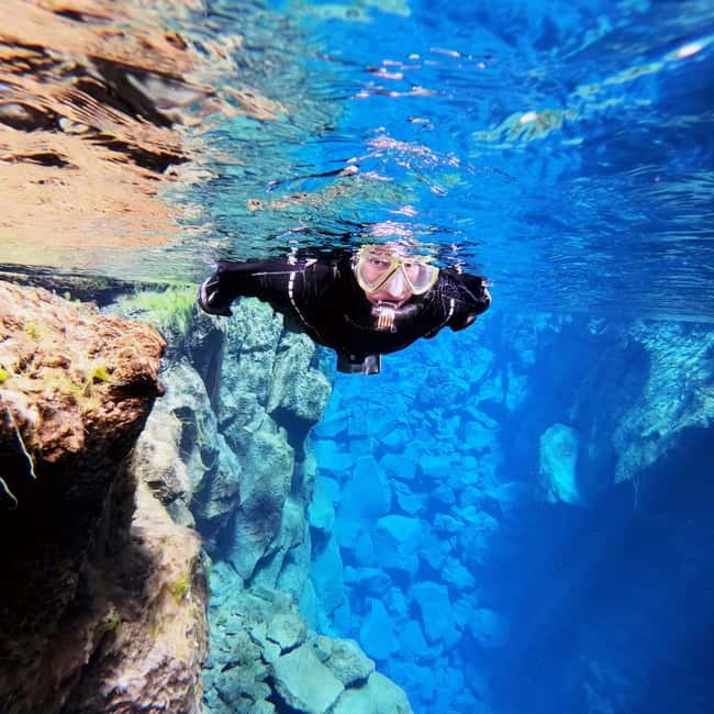 From Reykjavik: Silfra Snorkeling with Free Photos - Getting dressed for cold Icelandic water
