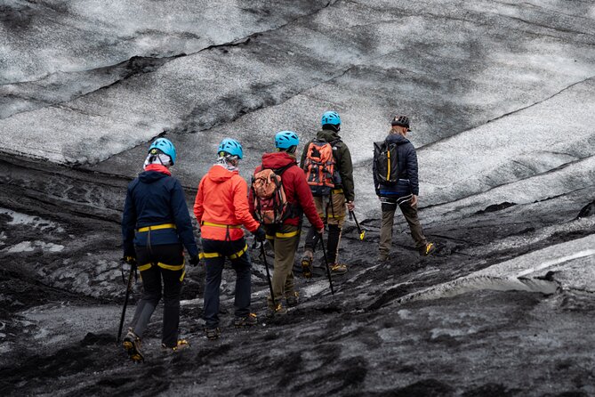 Private Glacier Hike on SÓLHEIMAJÖKULL : Blue Ice Expedition - Walking across ash-marked ridges and frozen waves