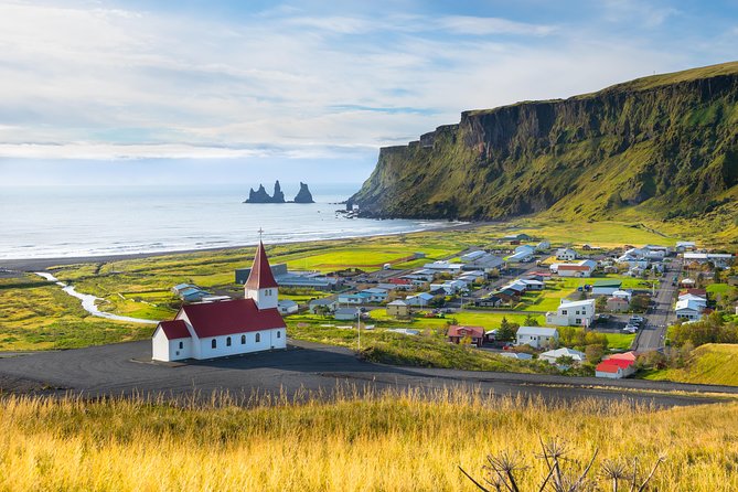 Private Jeep Tour - Glacier Lagoon and Diamond Beach - Vik and Dyrholaey: village views, cliffs, and black sand