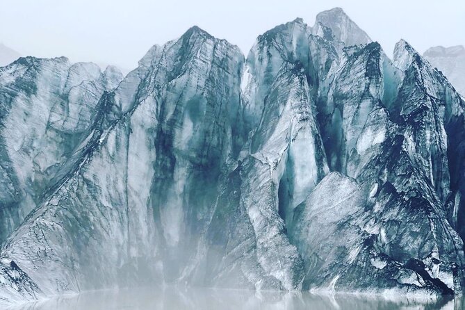 Private tour to the South Coast of Iceland - Sólheimajökull shows ice marked by volcanic ash