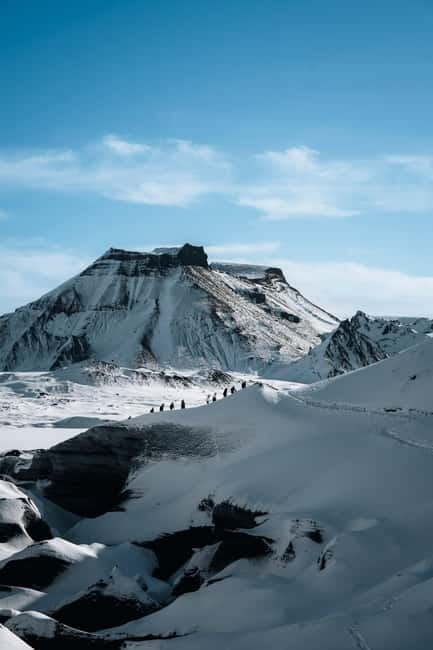 Reykjavik: Katla Ice Cave & South Coast Waterfalls Tour - Inside Kötlujökull, expect wet boots and strange colors