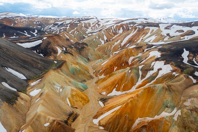 Reykjavík: Landmannalaugar & Icelandic Highlands Super Jeep Tour - Hjálparfoss, a small waterfall with a useful story