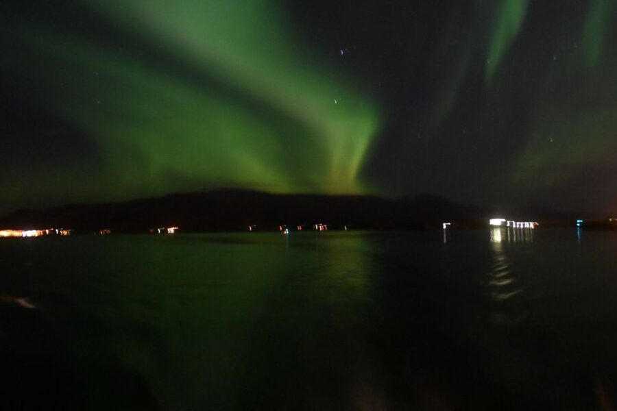 Reykjavik: Northern Lights Guided Boat Tour - Warm overalls, hot drinks, and the cold problem