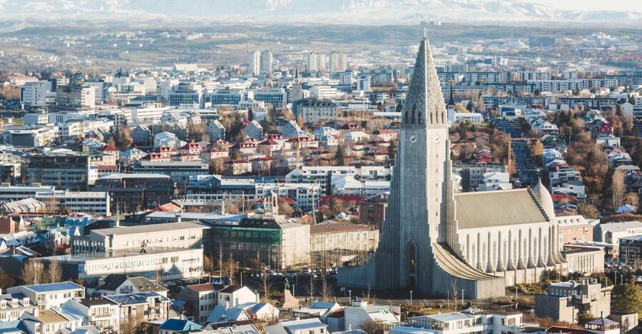 Reykjavik: Panoramic Helicopter Flight with Summit Landing - Leaving the city for a mountain summit