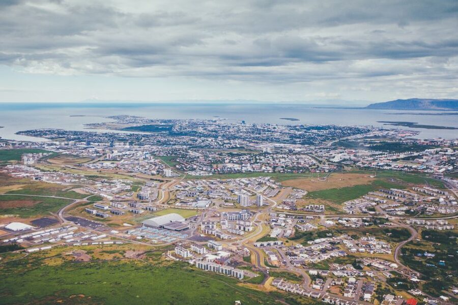 Reykjavik: Panoramic Helicopter Flight with Summit Landing - Reykjavik from above: Harpa, Hallgríms Church, and bright rooftops