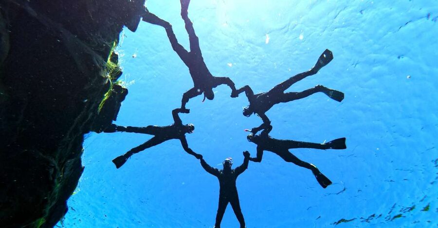 Silfra: Half-Day Snorkeling Day Trip with Underwater Photos - Entering Silfra and floating through the rift