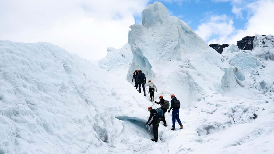 Skaftafell: Glacier Hike & Ice Climbing Adventure - Looking into crevasses, formations, and possible ice caves