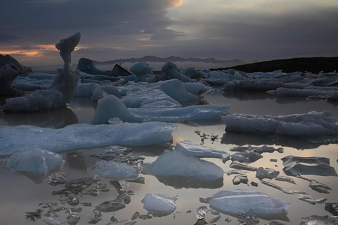 South Coast and Glacier Lagoon Day Trip by Super Jeep from Reykjavik - Dyrhólaey and Reynisfjara show Iceland’s darker coast