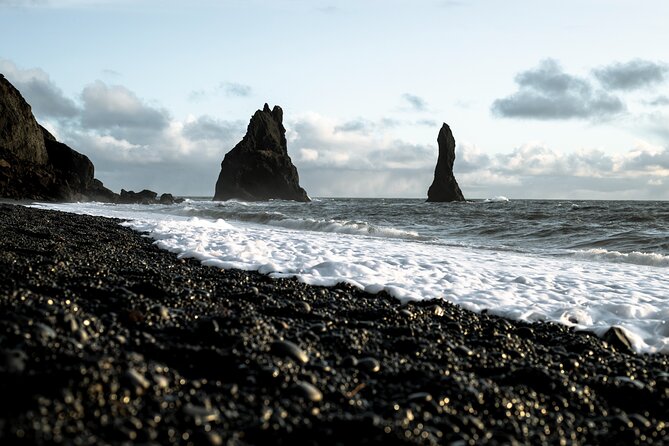 South Iceland Highlights and Northern Lights Combo Full-Day Tour - Reynisfjara: black sand and dangerous waves
